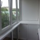 Балкон из ПВХ профиля вид изнутри со шкаф-тумбой